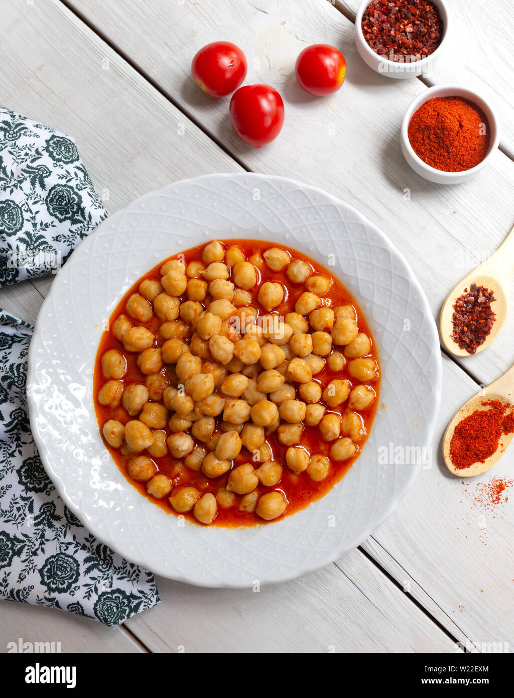 Vegetarian tasty spicy chick pea soup on a wooden background / Cheakpea stew/ Turkish nohut pilaki Stock Photo