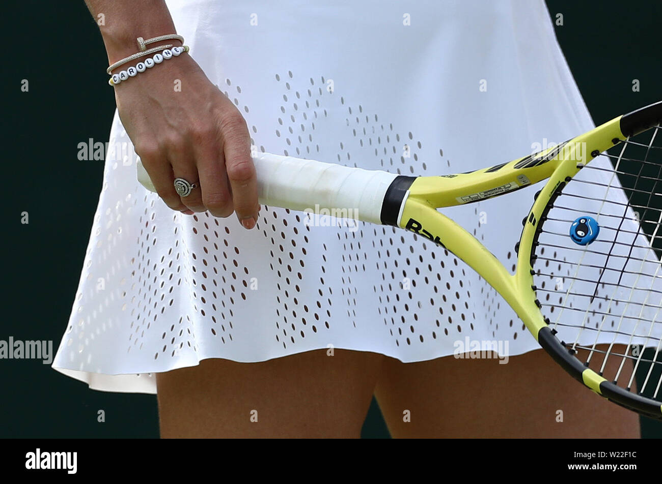 Wimbledon, London, UK. 05th July, 2019. 5th July 2019, The All England Lawn Tennis  and Croquet Club, Wimbledon, England, Wimbledon Tennis Tournament, Day 5;  Caroline Wozniacki detail shows her bracelets and racquet