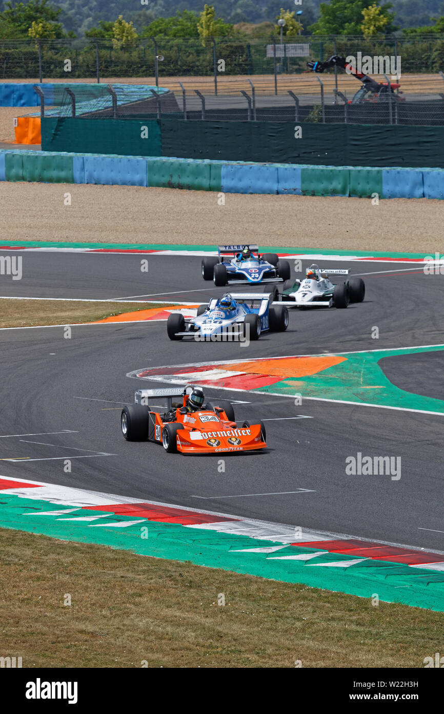 MAGNY-COURS, FRANCE, June 30, 2019 : The F1 pack at the chicane. French Historic Grand Prix takes place on Magny-Cours race track every two years. Stock Photo