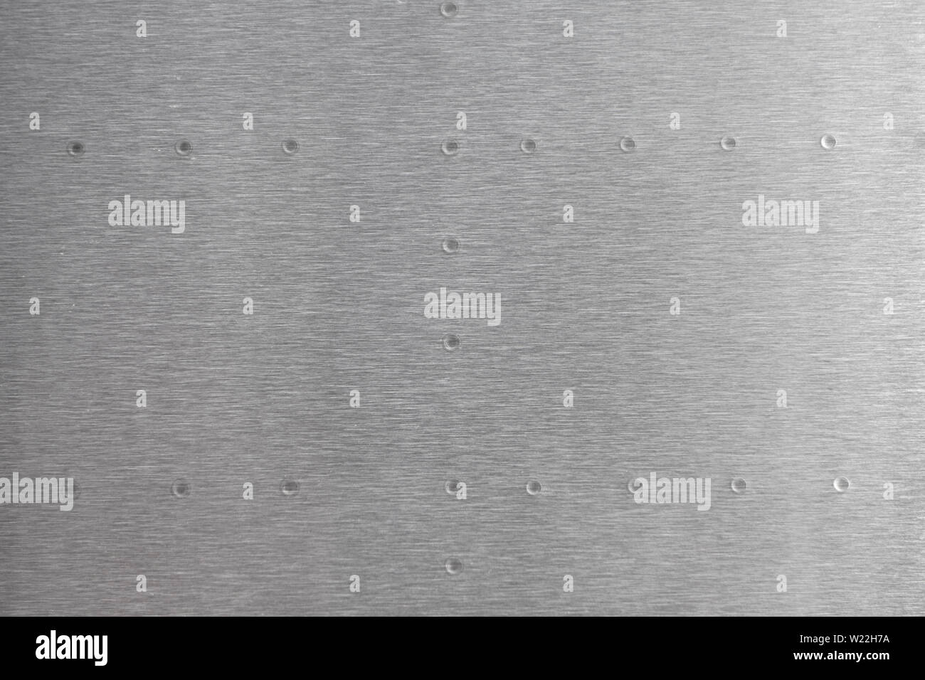 metal brushed with smooth out rivets Horizonal and vertical on a ...