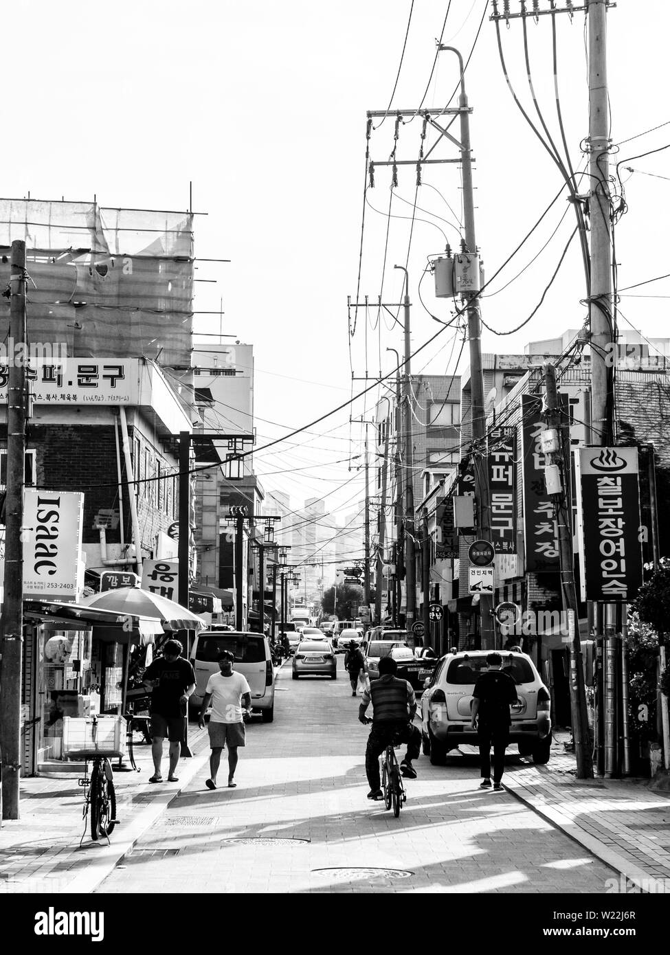 Suwon, South Korea - June 19, 2017: People walking along the main street in Suwon. Black and white image Stock Photo