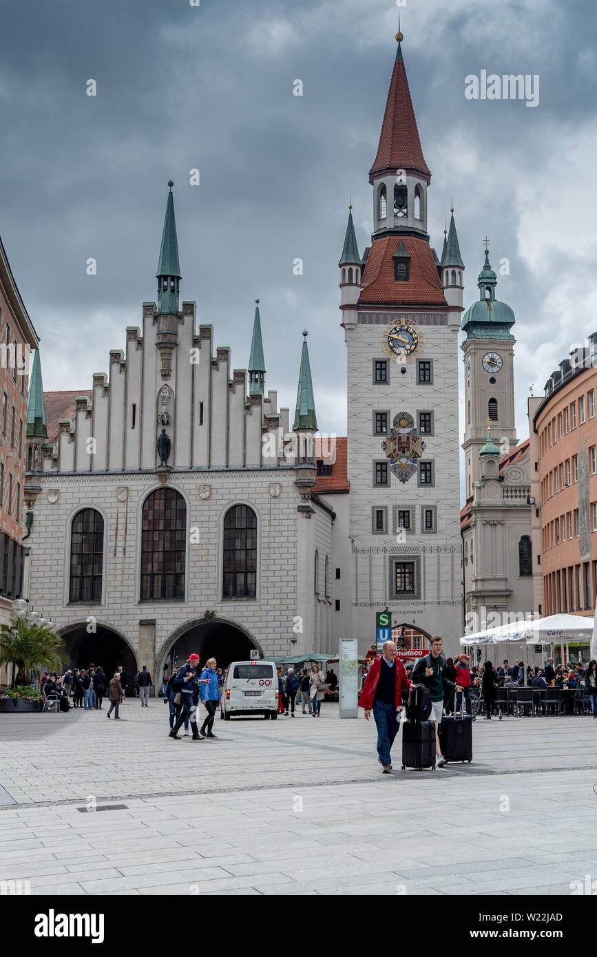 Munich, Bavaria, Germany - May 29, 2019. Tourists walking around in front of the new townhouse (Neue Rathaus) Stock Photo