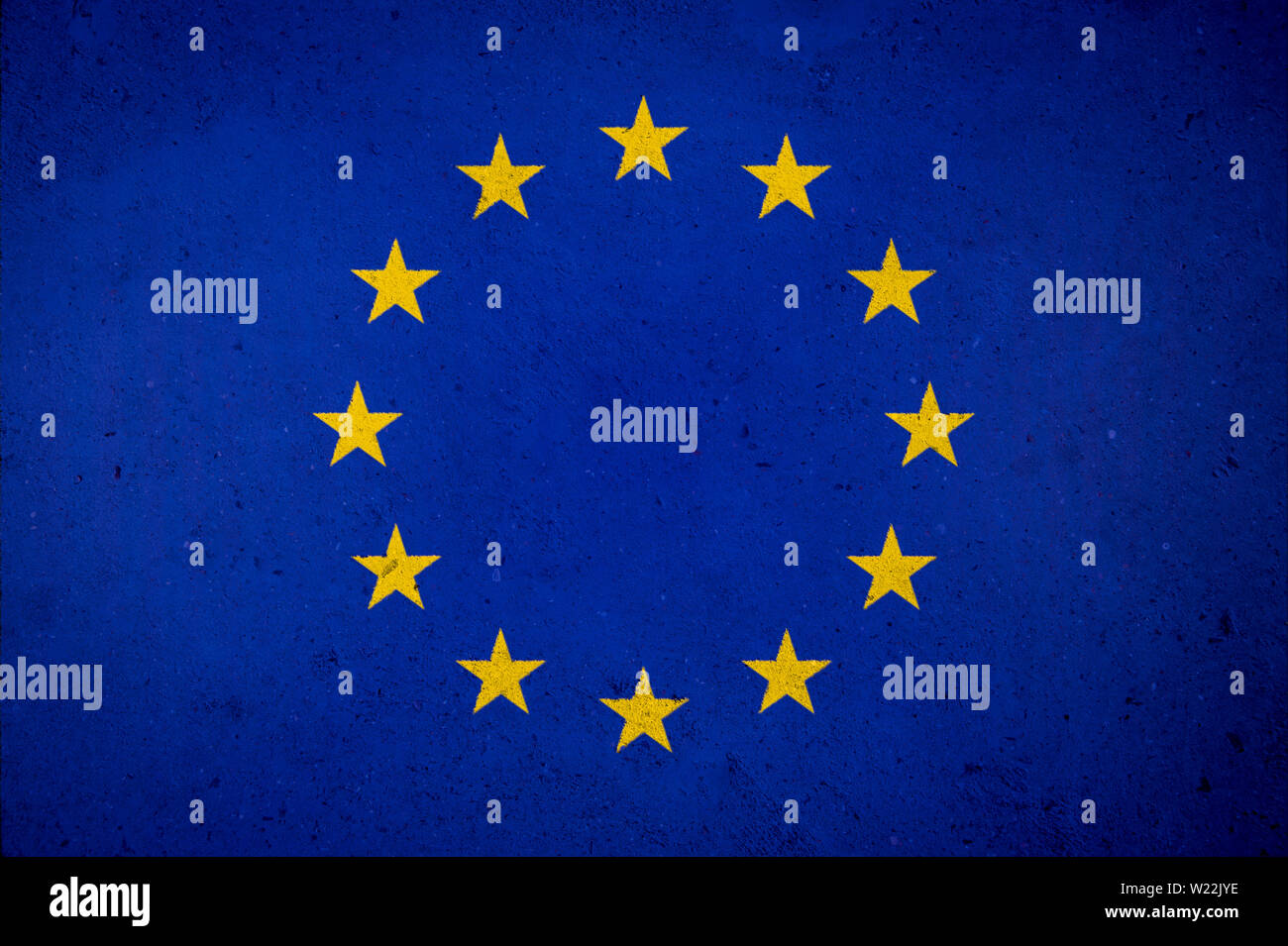 Grunge EU European Union flag painted on textured concrete wall background Stock Photo