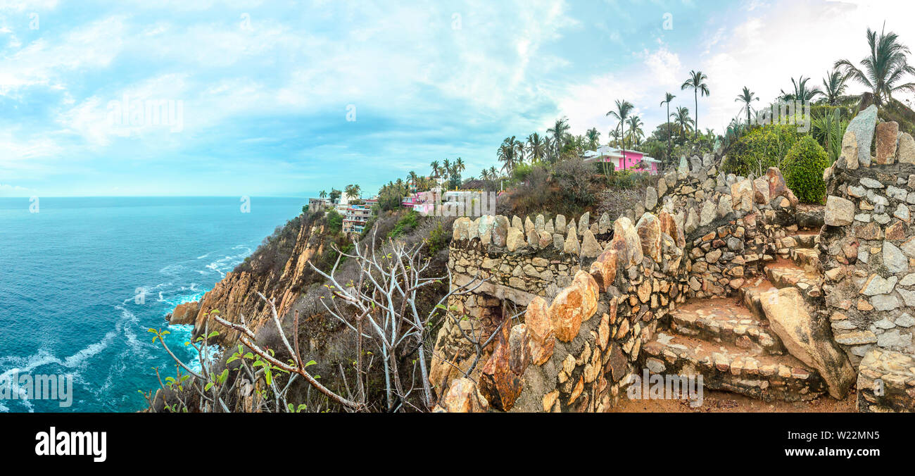 Acapulco coast blue sea with cliffs in sunny afternoon, Acapulco, Mexico. Stock Photo