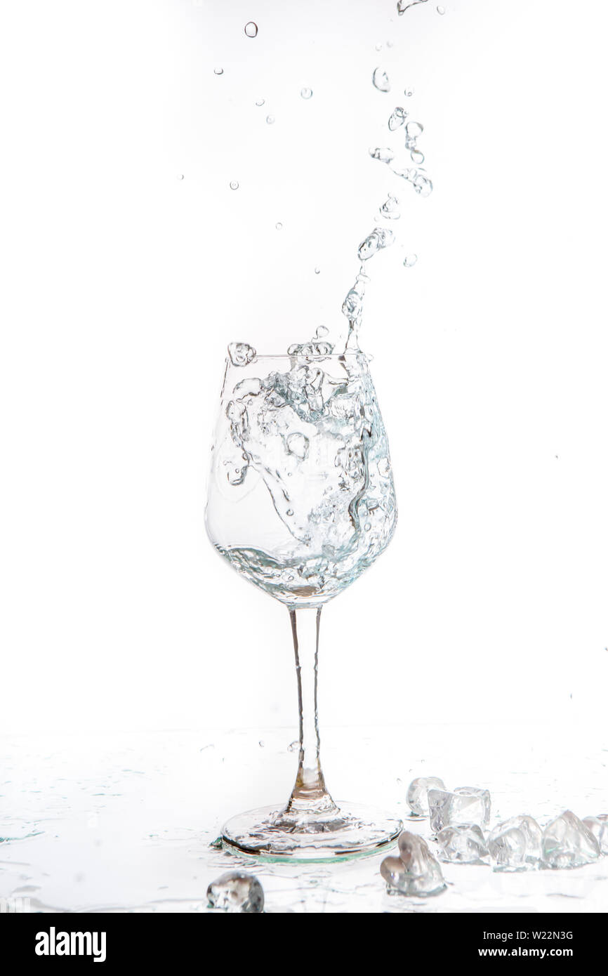 Glass of water and ice on a white background Stock Photo Alamy