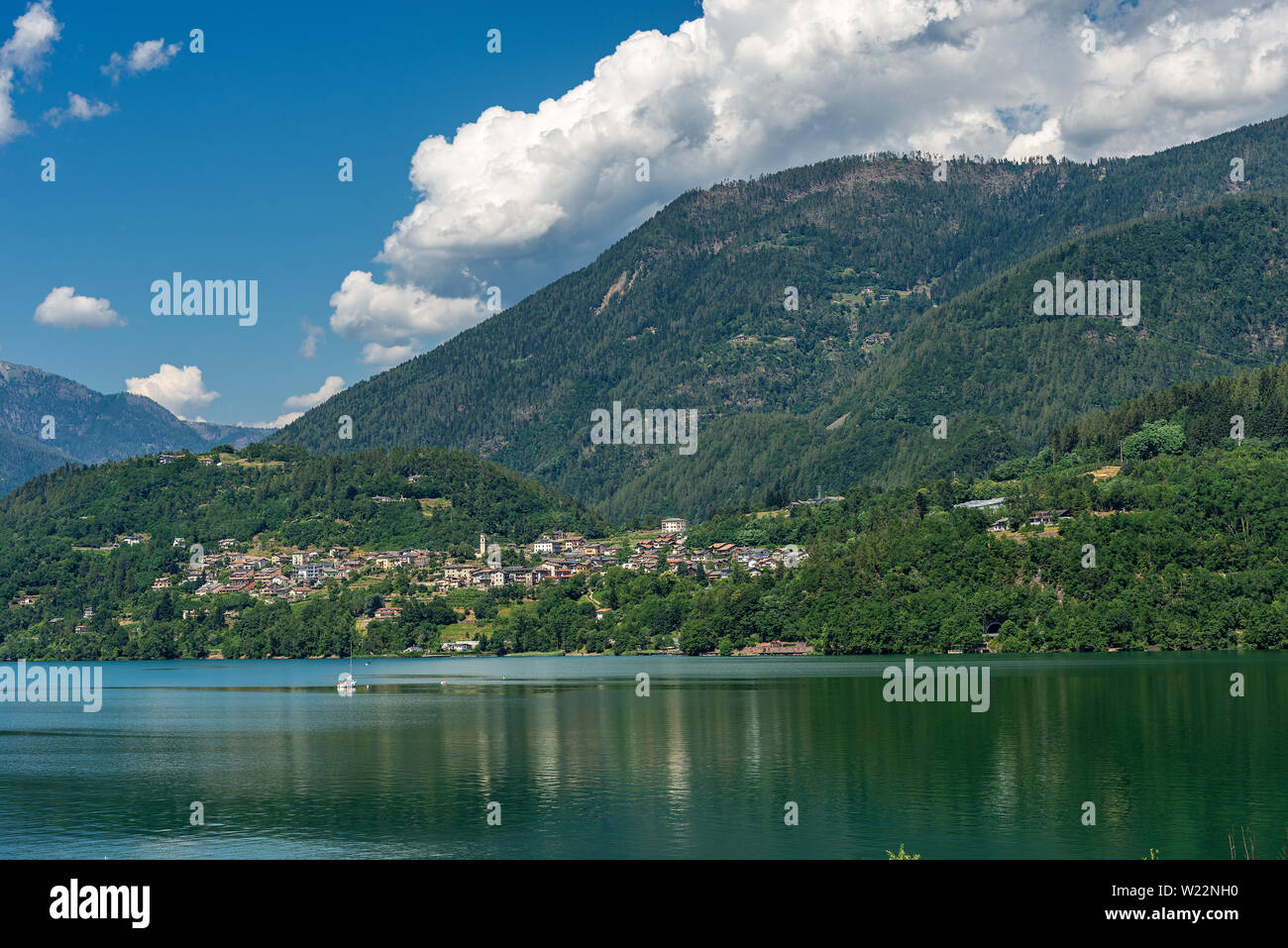 Caldonazzo lake (Lago di Caldonazzo) with the Alps and small village of Ischia, Valsugana valley, Trento province, Trentino Alto Adige, Italy, Europe Stock Photo