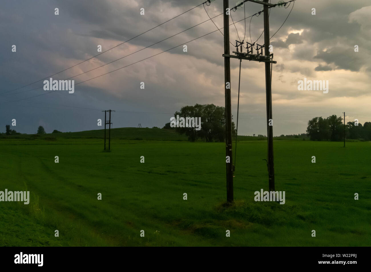 Supercell storm clouds above meadow with green grass Summer Storm ...