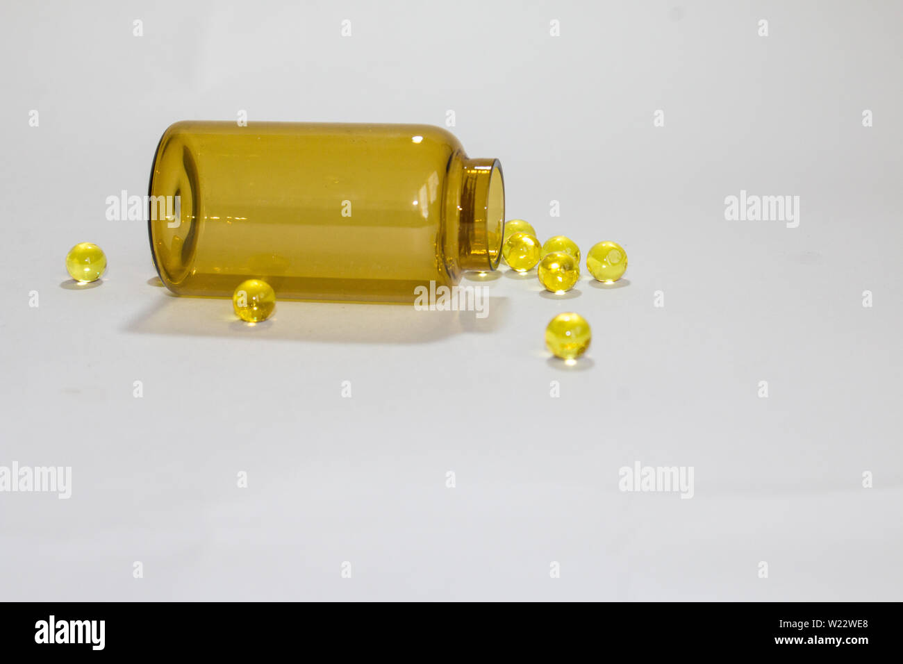 Download Yellow Transparent Round Tablets In A Transparent Bottle Stock Photo Alamy PSD Mockup Templates