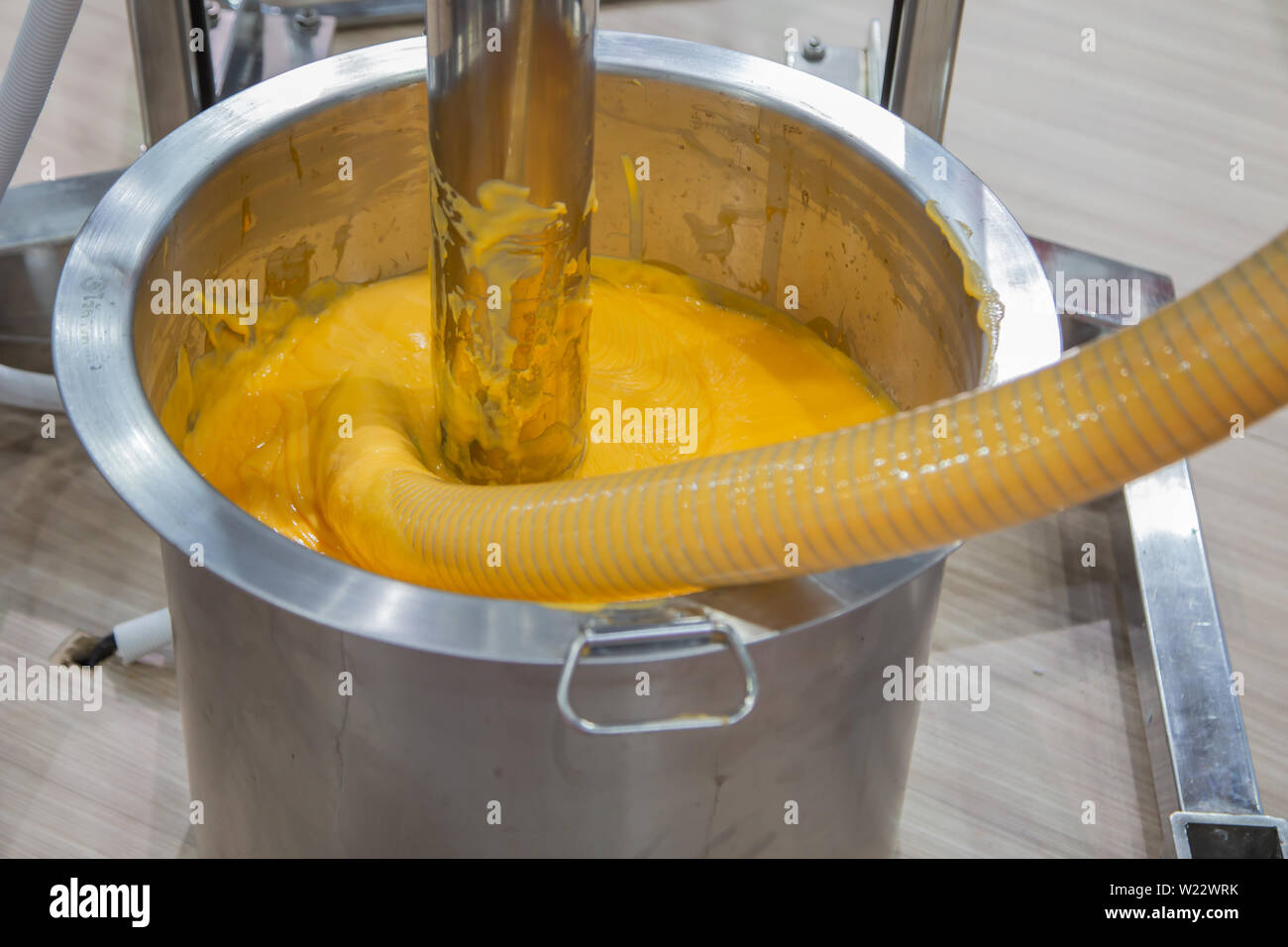Liquid mixer machine large barrel mixing food ingredient Stock Photo
