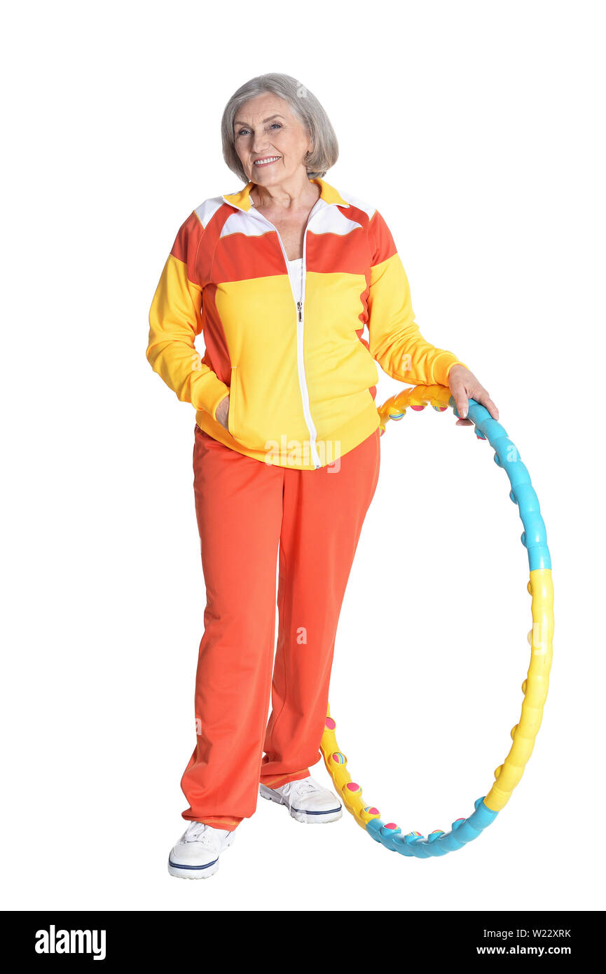 Portrait of senior woman posing with hoop on white background Stock ...