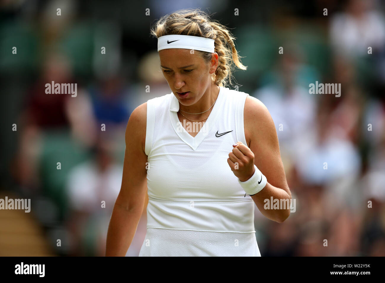 Victoria Azarenka in action against Simona Halep on day five of the  Wimbledon Championships at the All England Lawn Tennis and Croquet Club,  Wimbledon Stock Photo - Alamy