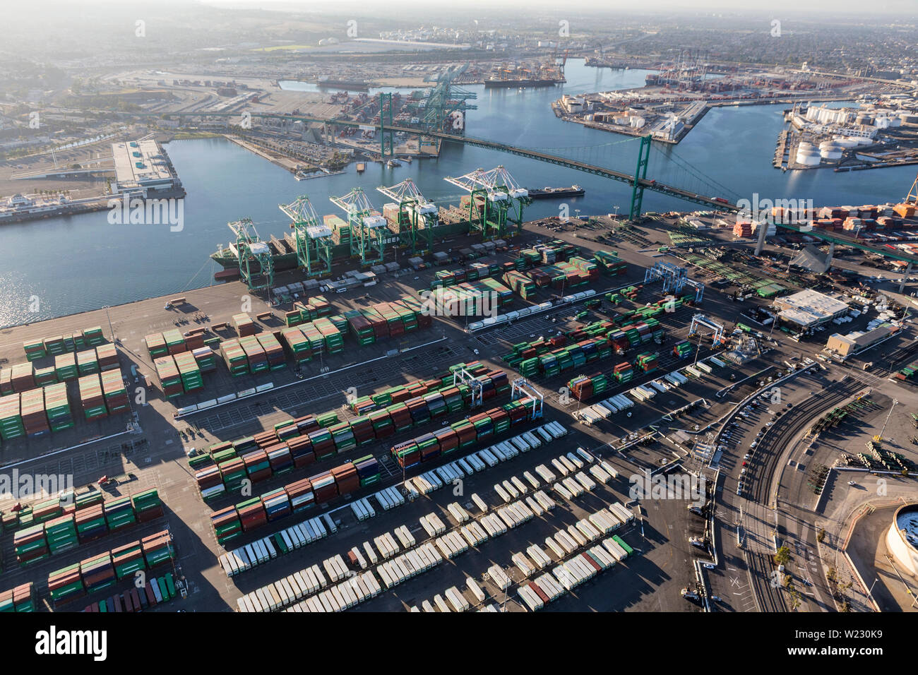 Los Angeles, California, USA - August 16, 2016:  Afternoon aerial view of busy container cargo facilities and the Vincent Thomas Bridge between San Pe Stock Photo