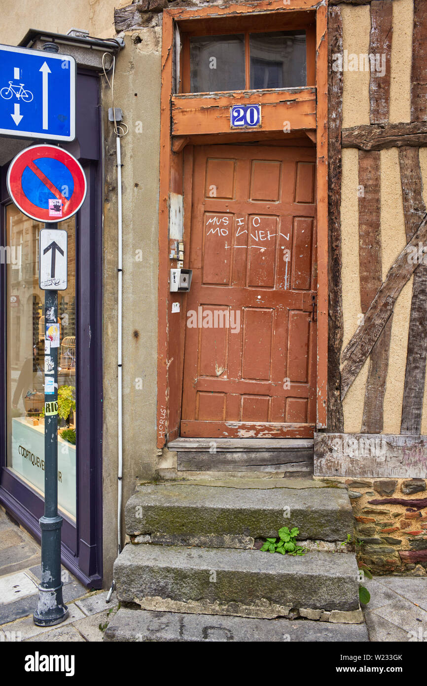 A very crooked wooden door in the city of Rennes the captial of Brittany Stock Photo