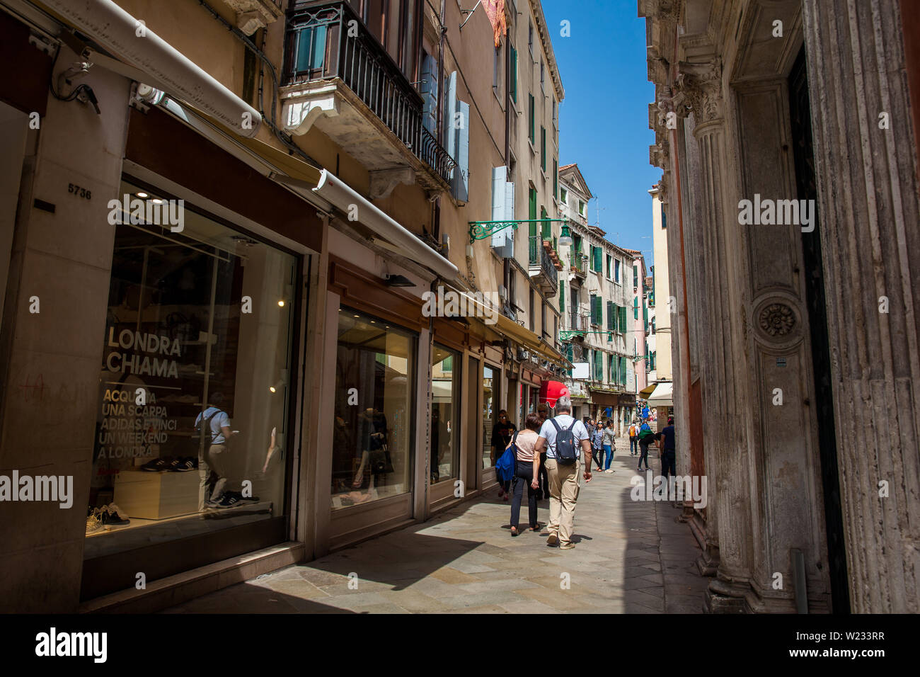 VENICE, ITALY - APRIL, 2018: Tourists and locals walking around the  beautiful streets of Venice in a sunny early spring day Stock Photo - Alamy