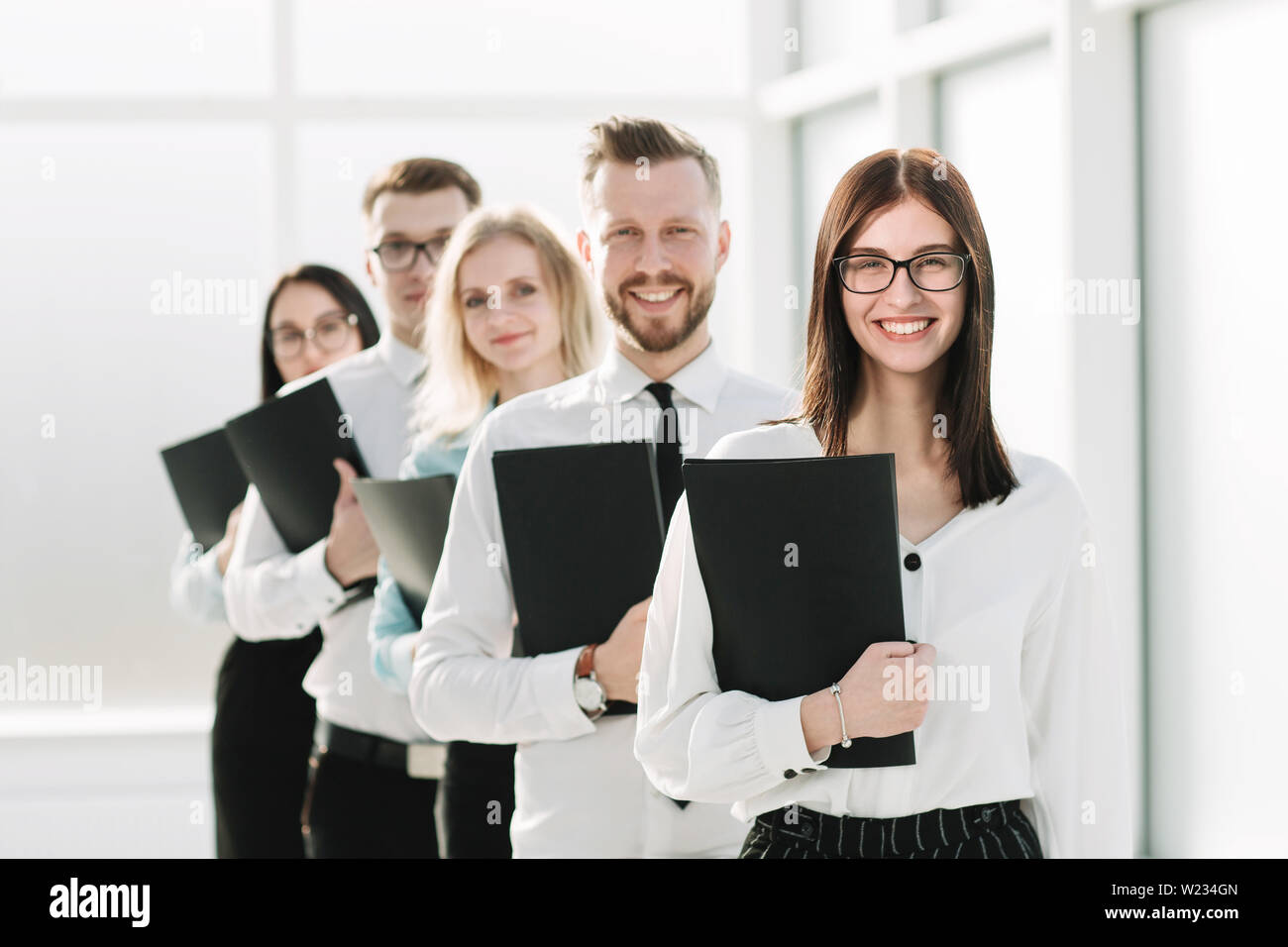 close up. a group of young entrepreneurs standing in line. photo with ...