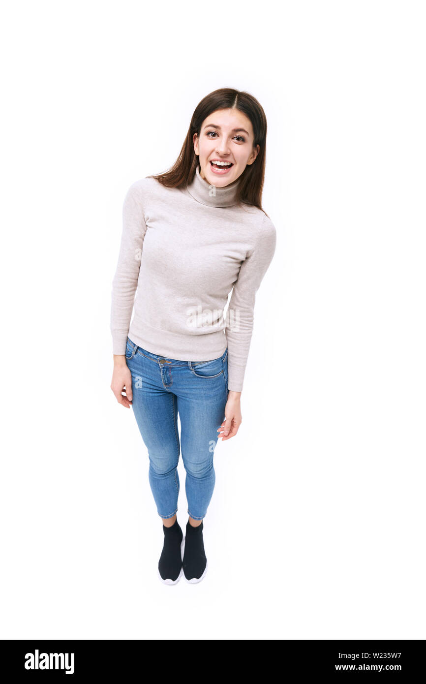 studio portrait of a beautful caucasian woman, looking at camera smiling, high angle view, isolated on white background Stock Photo