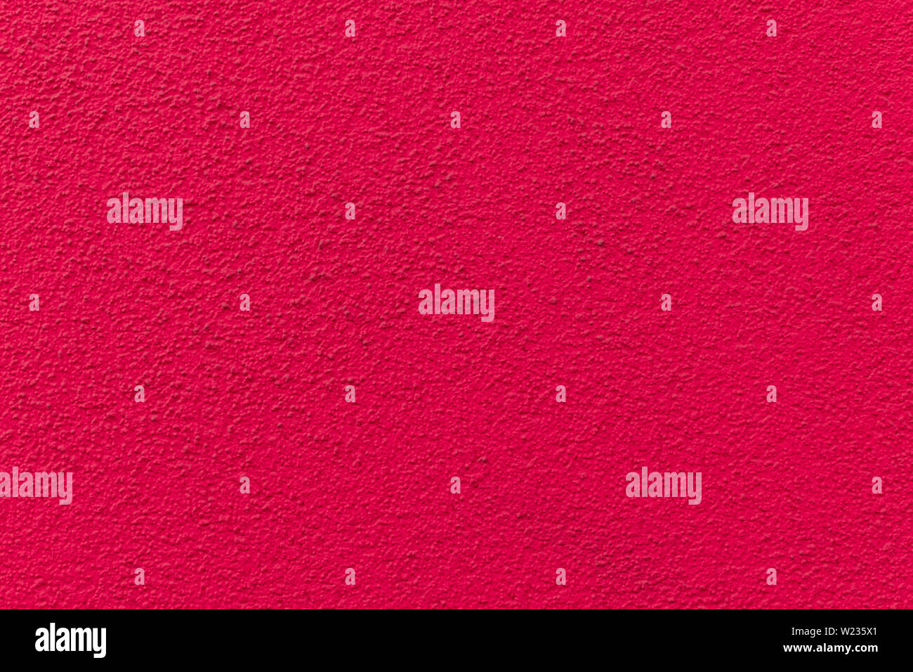 Pink painted cement wall, uneven concrete surface Stock Photo