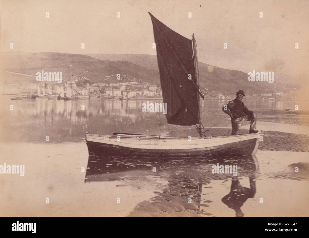 Victorian Late 1880's / Early 1890's Photograph Showing a Man Stood up in His Sailing Boat, Possibly a Fisherman. Photo Taken at Aberdovey, Wales Stock Photo