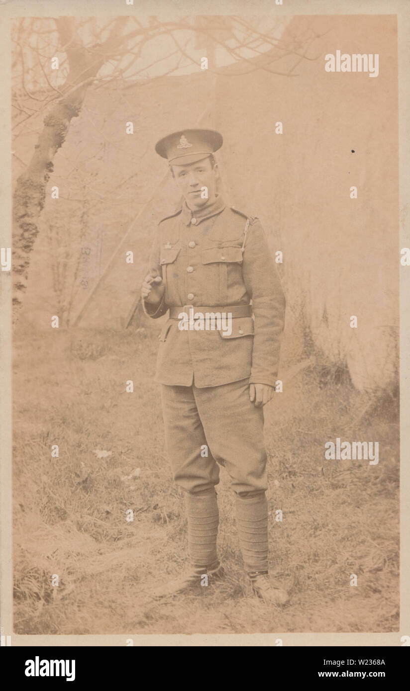 Vintage Studio Photographic Postcard Showing a Young and Proud WW1 British Army Soldier From The Royal Artillery. Stock Photo