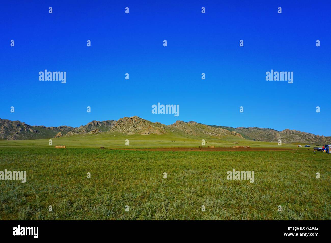 Blue sky infront of a mountain in rural Mongolia Stock Photo