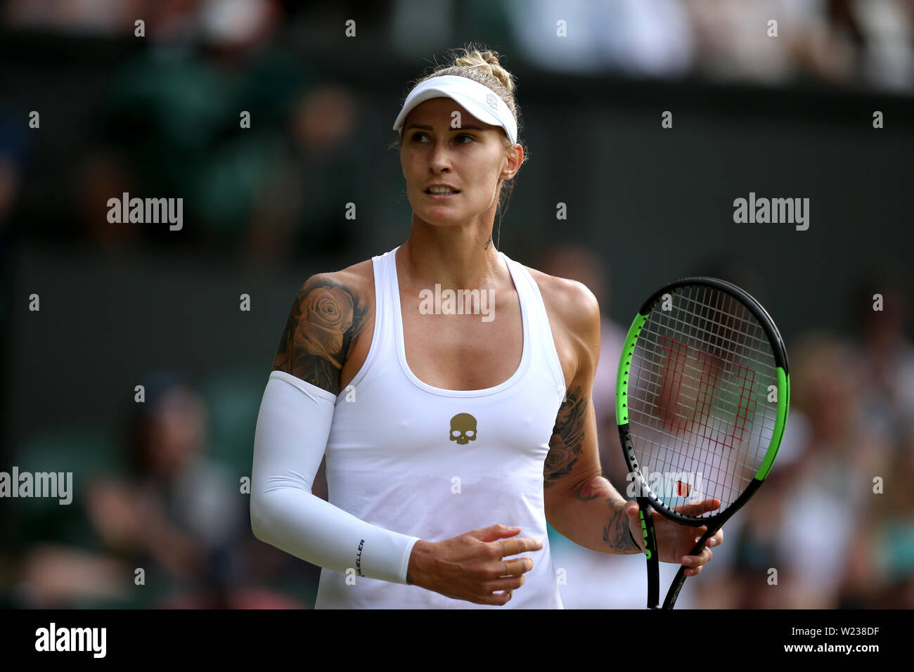 Tattoos on the upper body of Polona Hercog as she plays against Cori Gauff  on day five of the Wimbledon Championships at the All England Lawn Tennis  and Croquet Club, Wimbledon Stock
