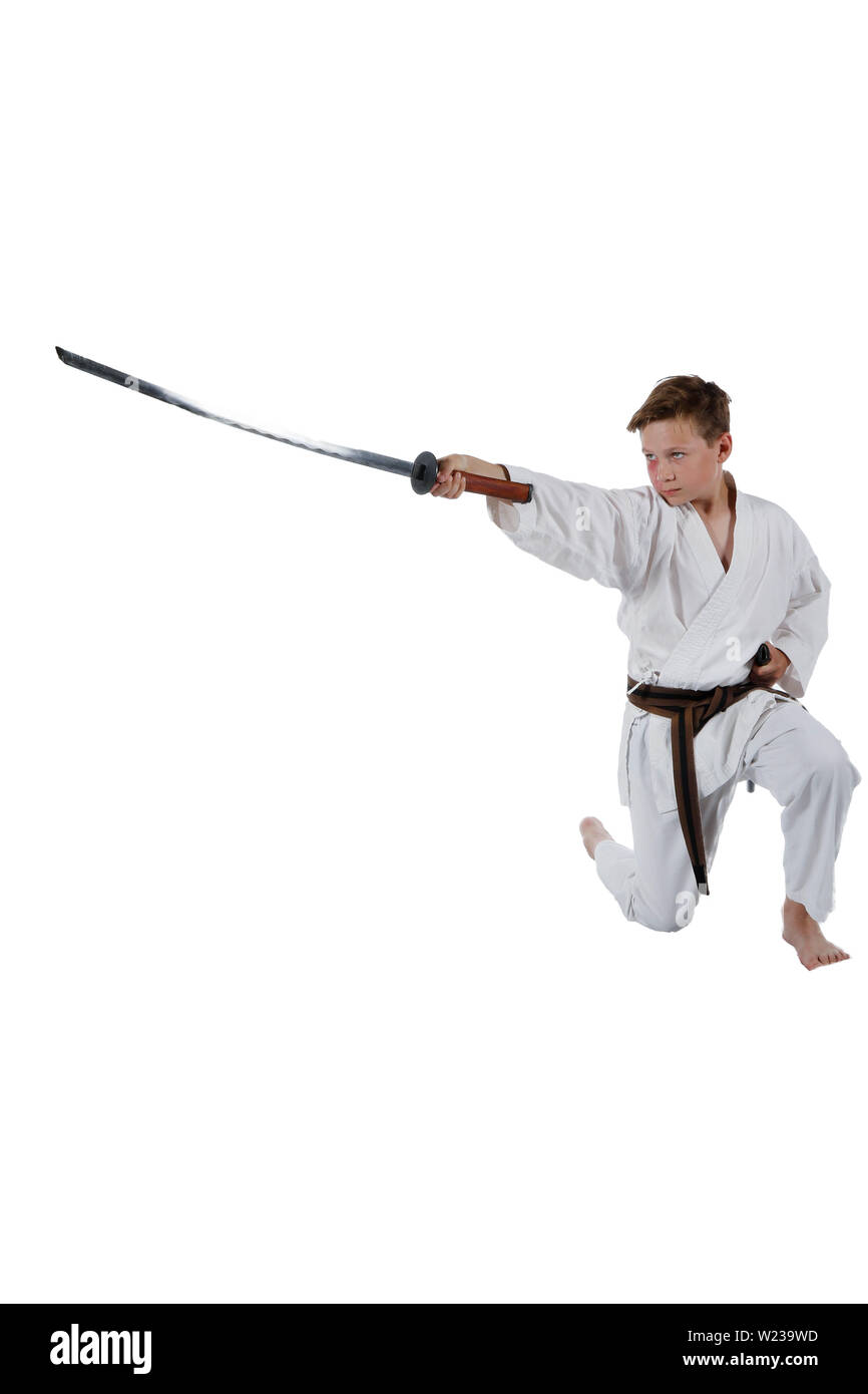 Teenage caucasian boy wearing a karate uniform with a katana Stock Photo -  Alamy
