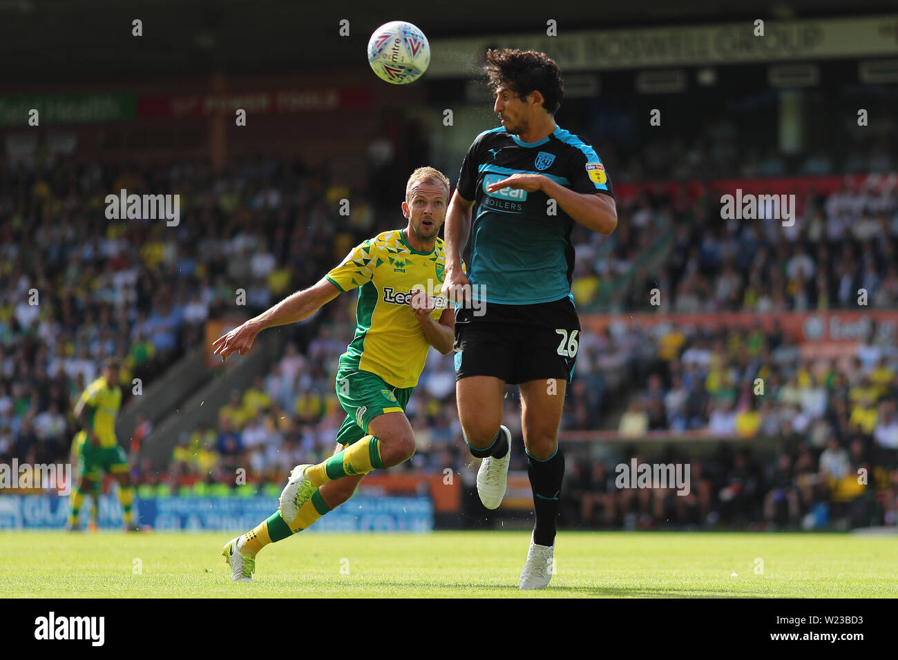 Ahmed Hegazy of West Bromwich Albion clears the ball from Jordan Rhodes of Norwich City - Norwich City v West Bromwich Albion, Sky Bet Championship, Carrow Road, Norwich - 11th August 2018 Stock Photo