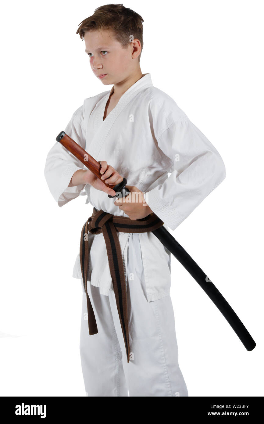 Teenage caucasian boy wearing a karate uniform drawing a katana Stock Photo  - Alamy