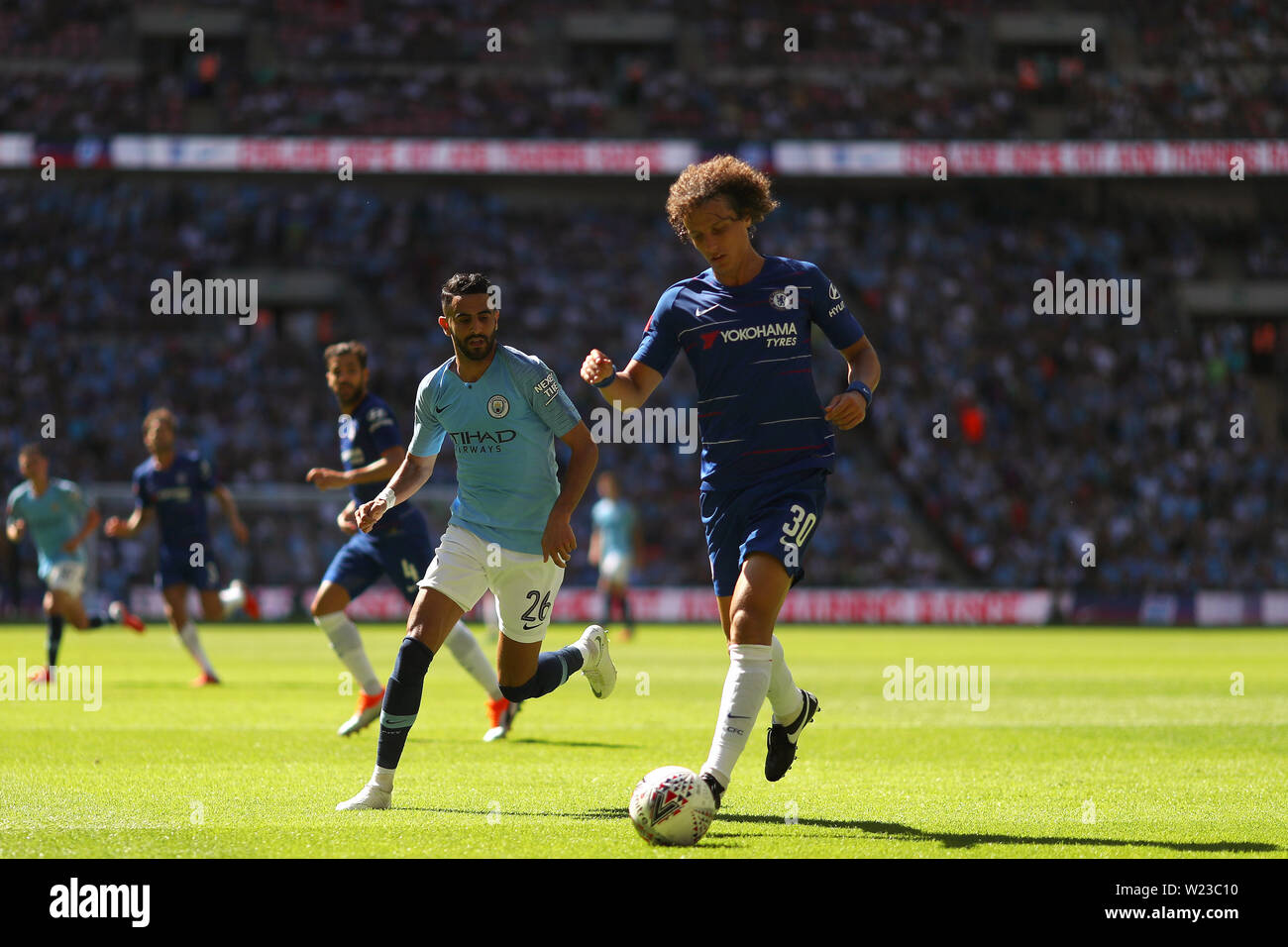 David Luiz of Chelsea comes away with the ball with Riyad Mahrez of Manchester City in pursuit - Chelsea v Manchester City, FA Community Shield, Wembley Stadium, London (Wembley) - 5th August 2018 Stock Photo