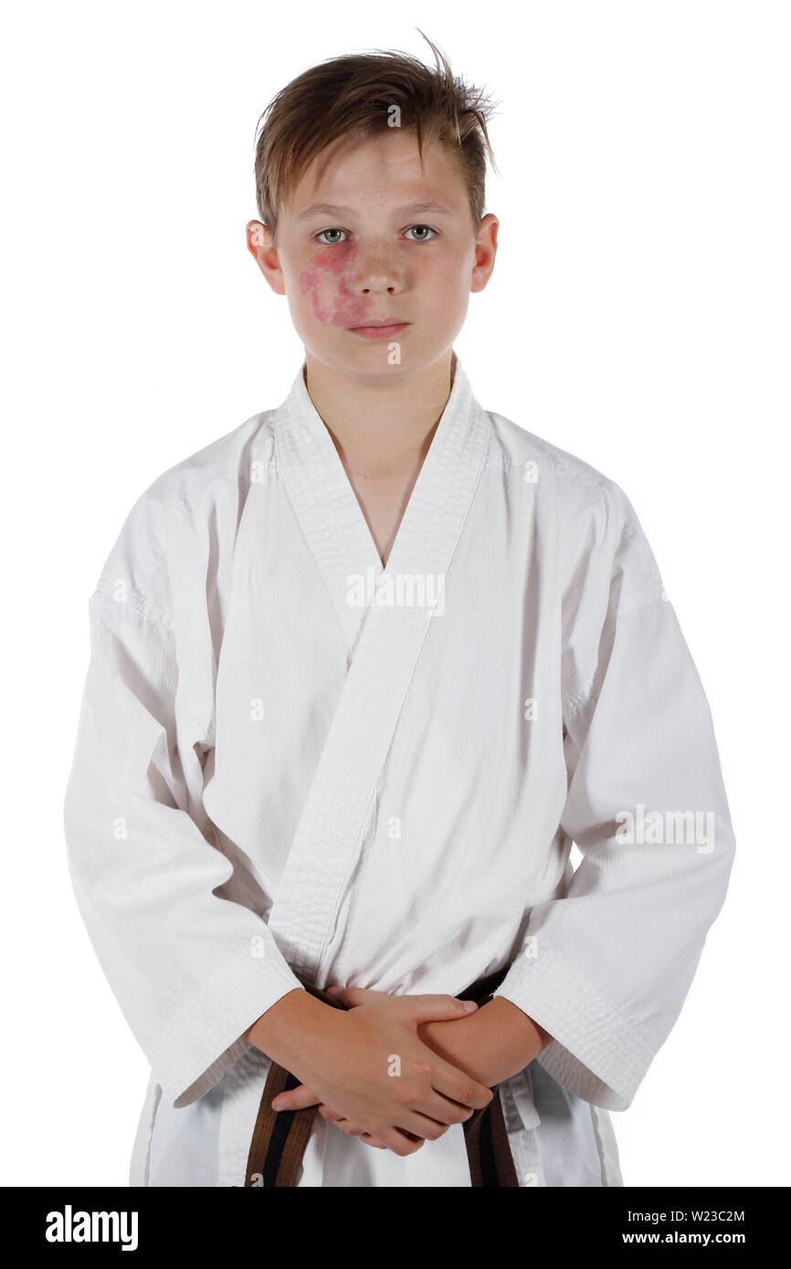 Teenage caucasian boy wearing a karate uniform Stock Photo Alamy