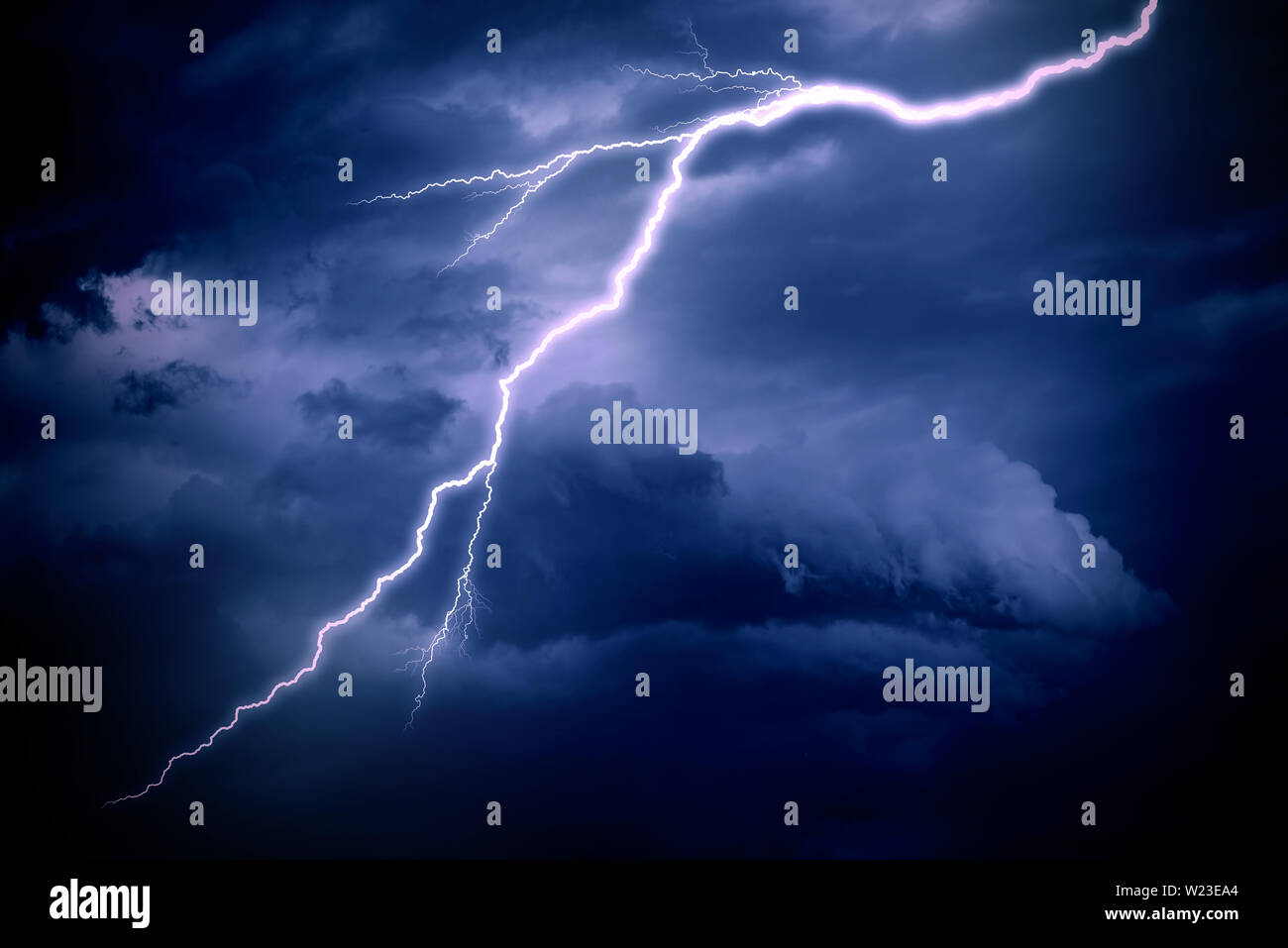 Lightning strike on a cloudy dark sky Stock Photo - Alamy