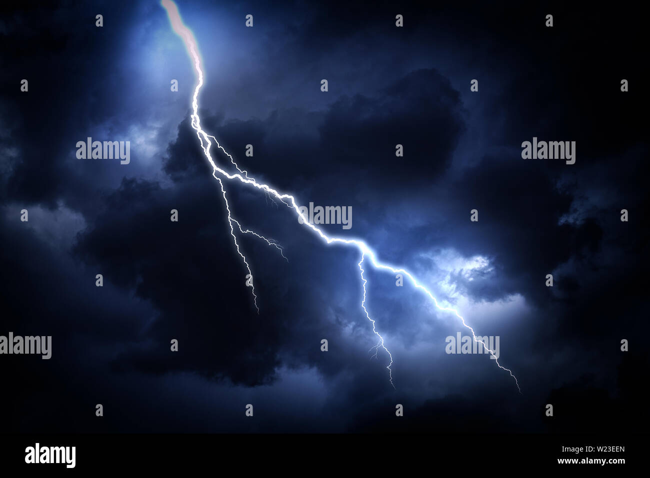 Lightning strike on a cloudy dark sky Stock Photo - Alamy