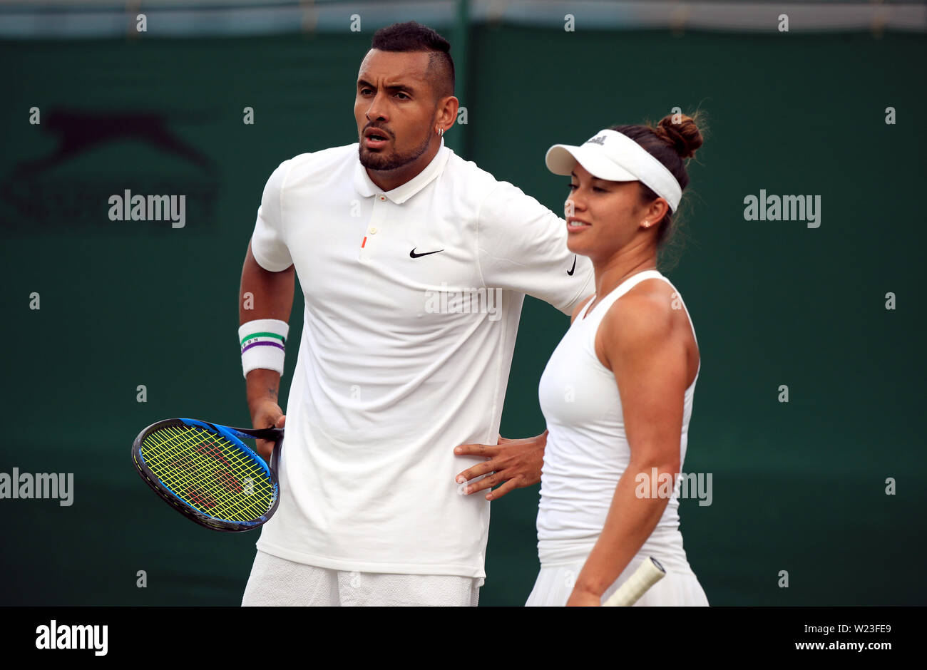 Nick Kyrgios and Desirae Krawczyk in action during the mixed doubles on day  five of the Wimbledon Championships at the All England Lawn Tennis and  Croquet Club, Wimbledon Stock Photo - Alamy