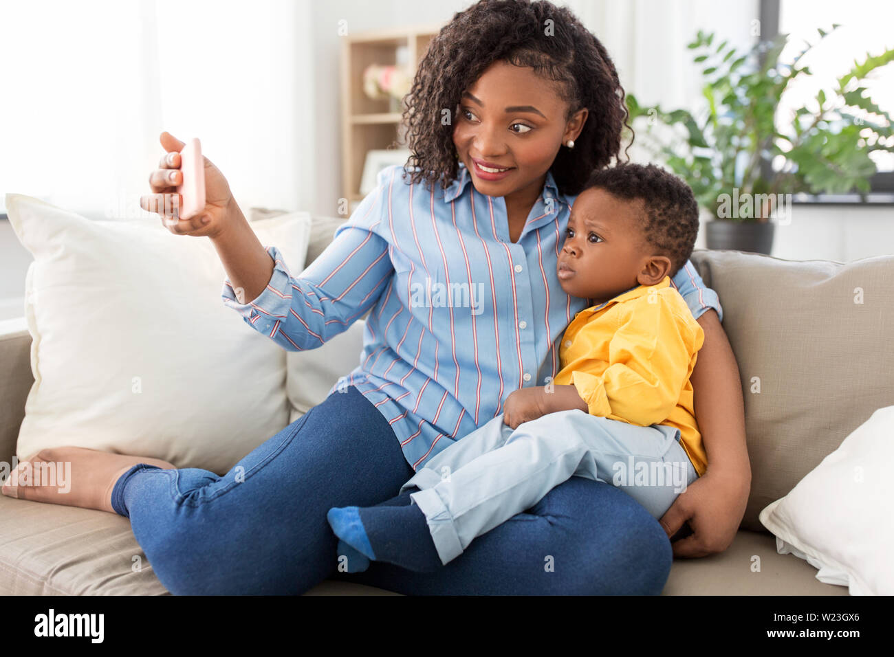 african mother with baby son taking selfie at home Stock Photo - Alamy