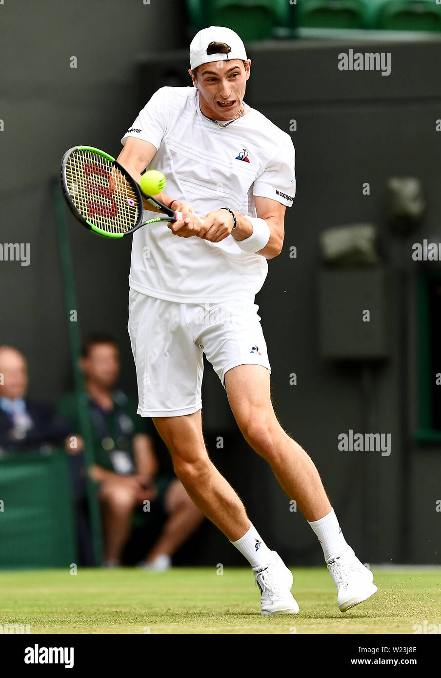 Ugo Humbert in action against Felix Auger Aliassime on day five of the  Wimbledon Championships at the All England Lawn Tennis and Croquet Club,  Wimbledon Stock Photo - Alamy