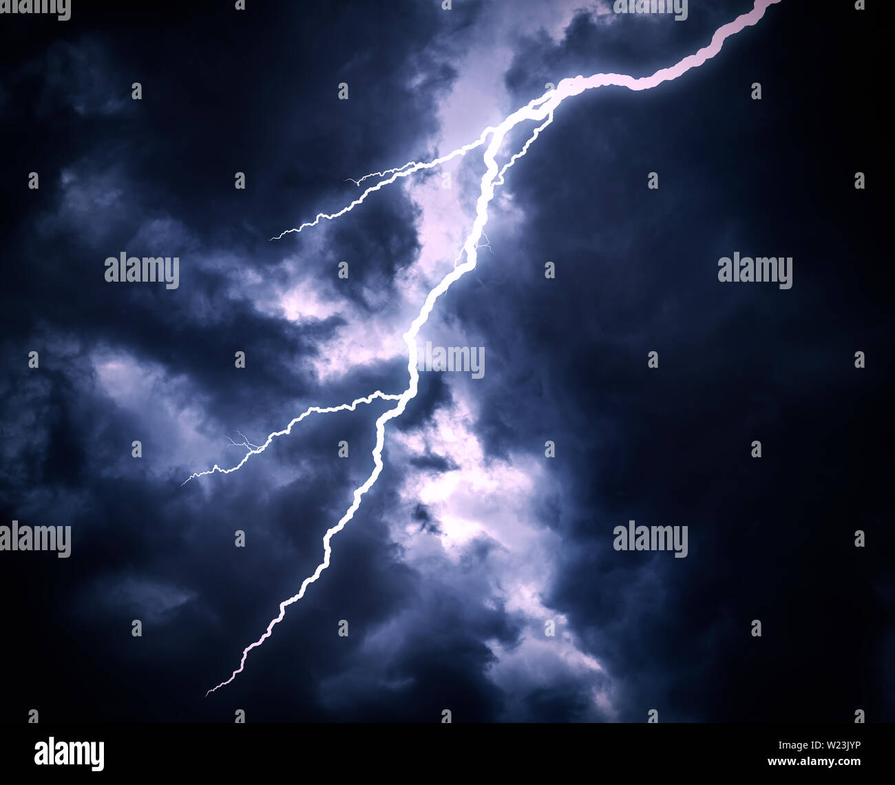 Lightning strike on a cloudy dark sky Stock Photo - Alamy