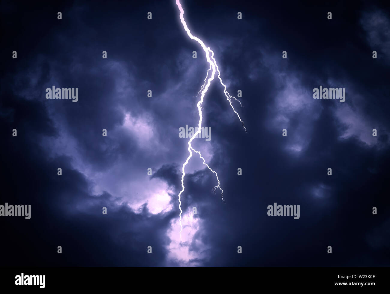 Lightning strike on a cloudy dark sky Stock Photo - Alamy