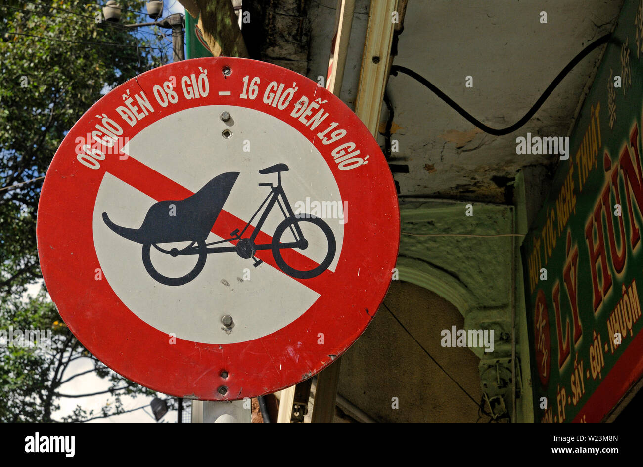 ho chi minh city, vietnam - november 06, 2008: a traffic sign indicating  no trespass for trishaws in cholon old town Stock Photo