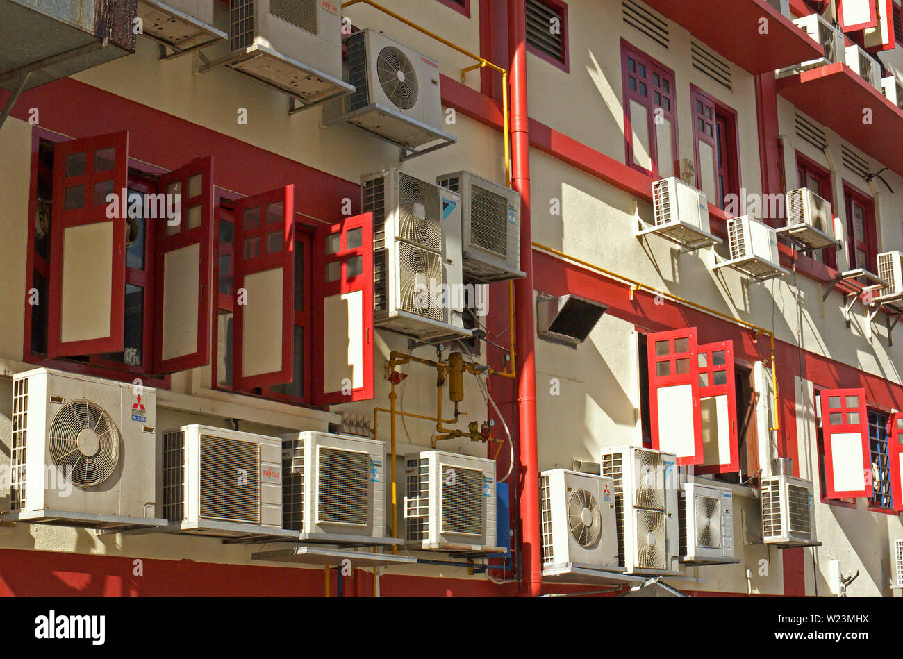 singapore, singapore - november 29, 2011: facade of a residential house in geylang with a large number of air conditioning units Stock Photo