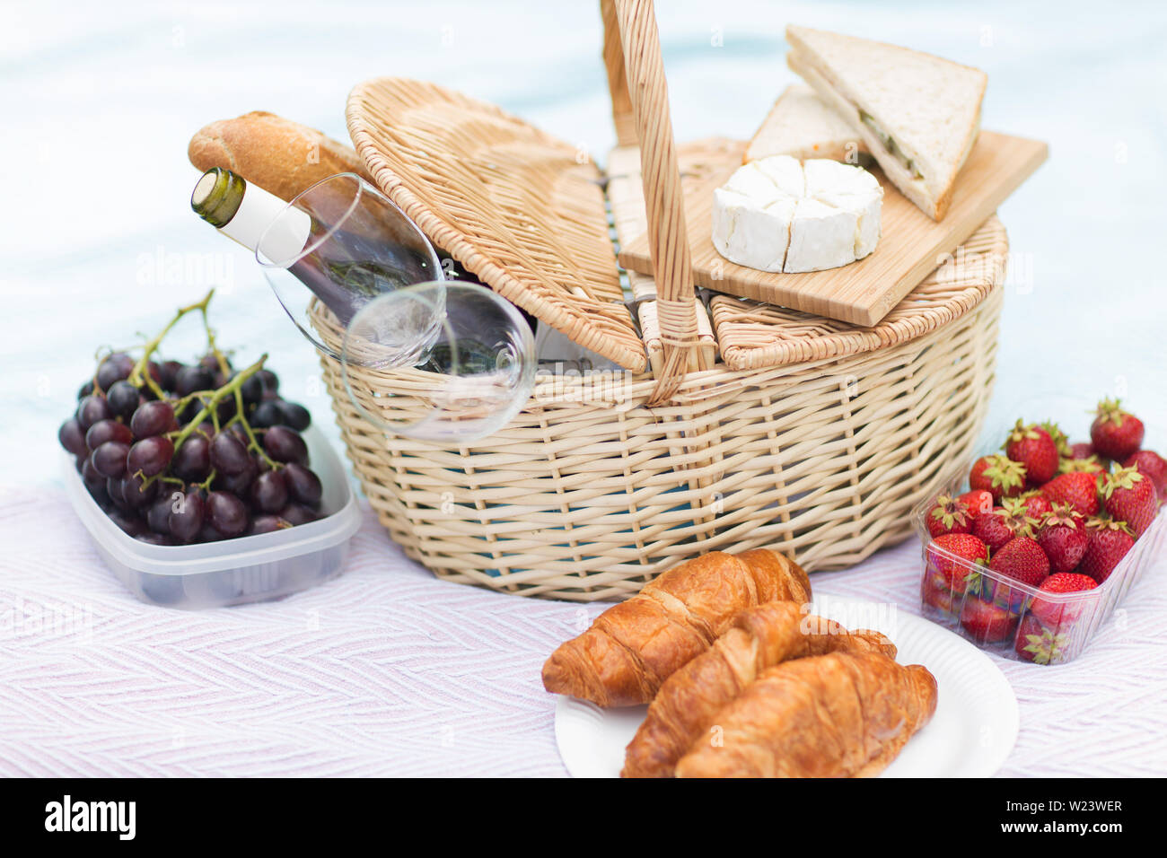 picnic basket, food and wine glasses on blanket Stock Photo Alamy