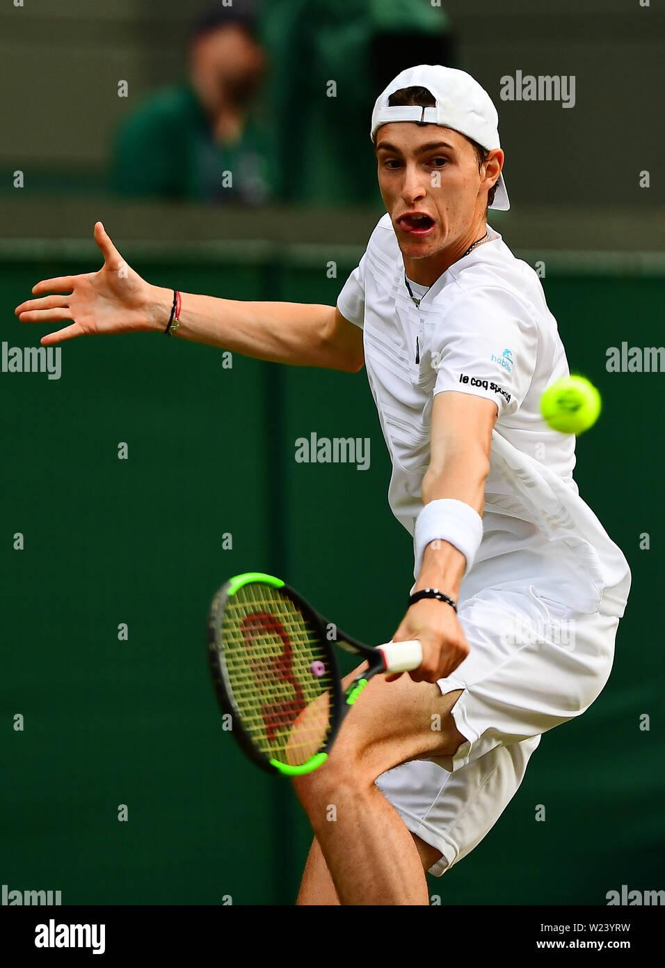 Ugo Humbert in action against Felix Auger Aliassime on day five of the  Wimbledon Championships at the All England Lawn Tennis and Croquet Club,  Wimbledon Stock Photo - Alamy