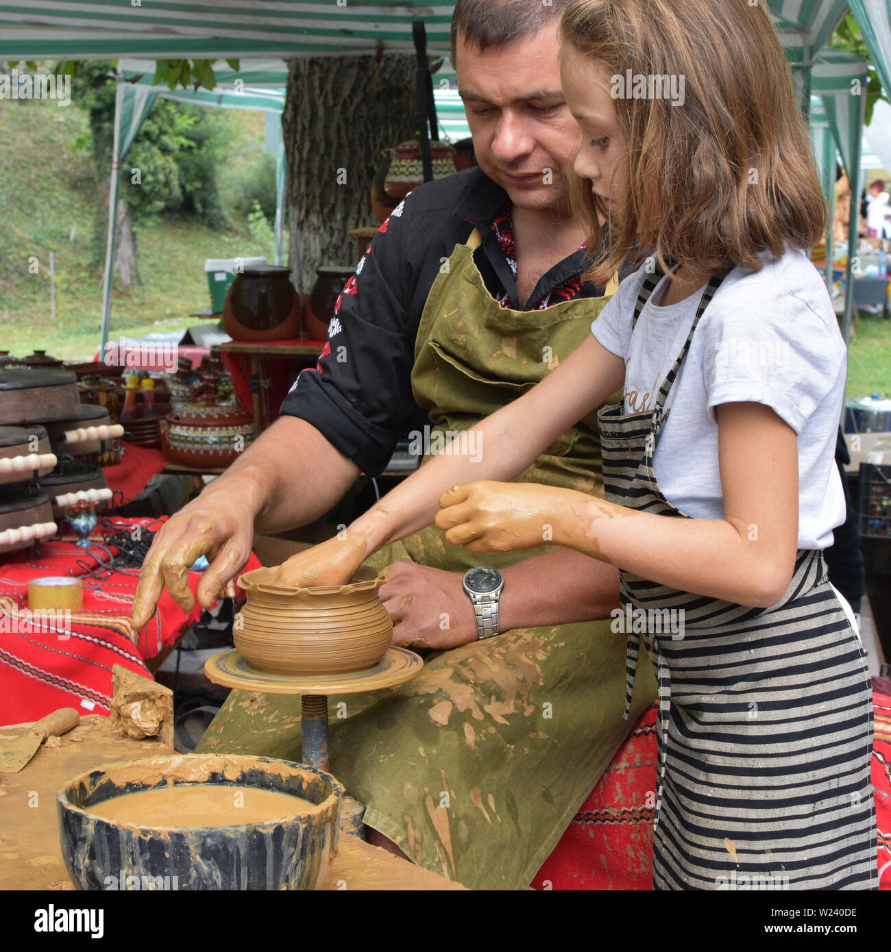 Etara, Bulgaria - September 6, 2018: Open-air pottery workshop for children during the folk festival in Etara Stock Photo
