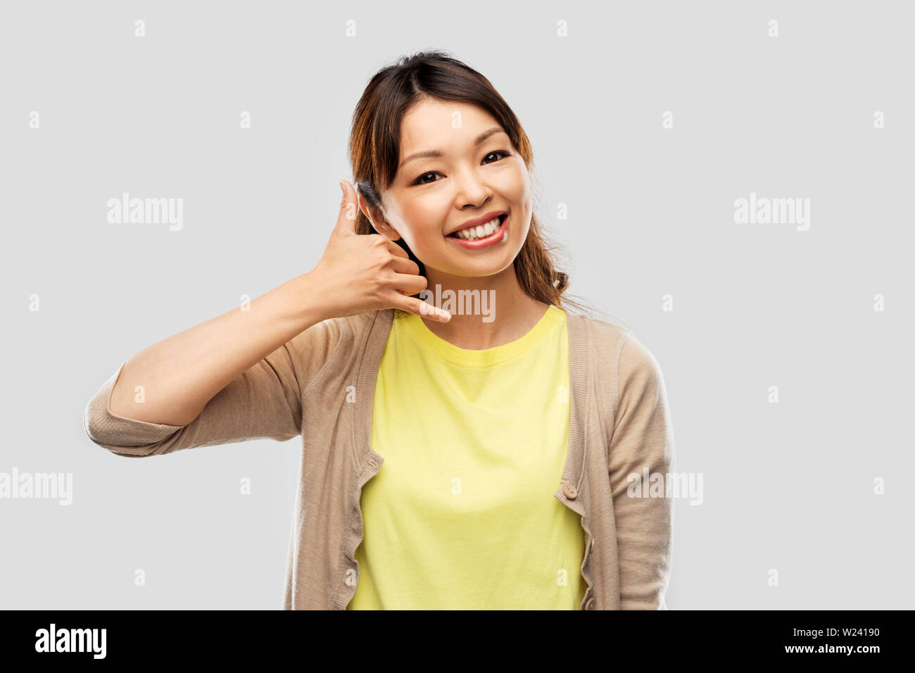 african asian making phone call gesture Stock Photo