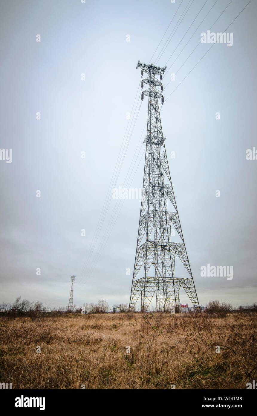 Tall transmission towers carrying power lines across the River Thames