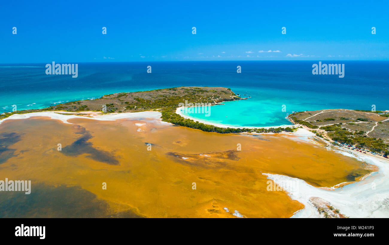 Aerial view of Puerto Rico. Faro Los Morrillos de Cabo Rojo. Playa Sucia beach and Salt lakes in Punta Jaguey. Stock Photo