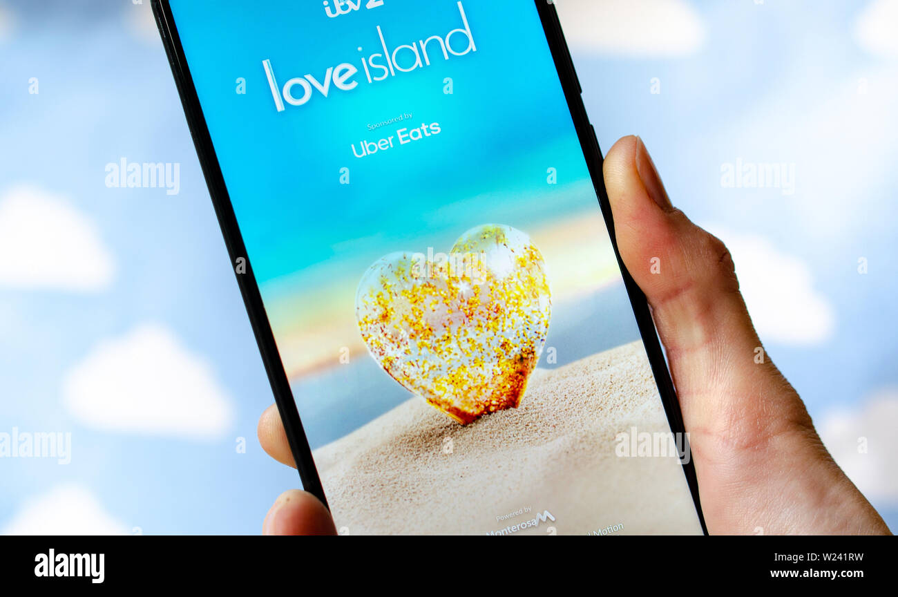 Love Island TV show - logo on the smartphone screen. Stock Photo