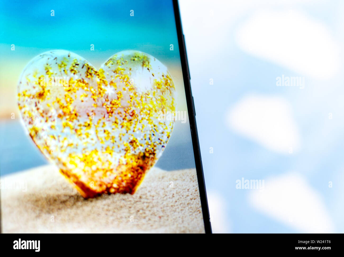 Love Island TV show - logo on the smartphone screen. Stock Photo