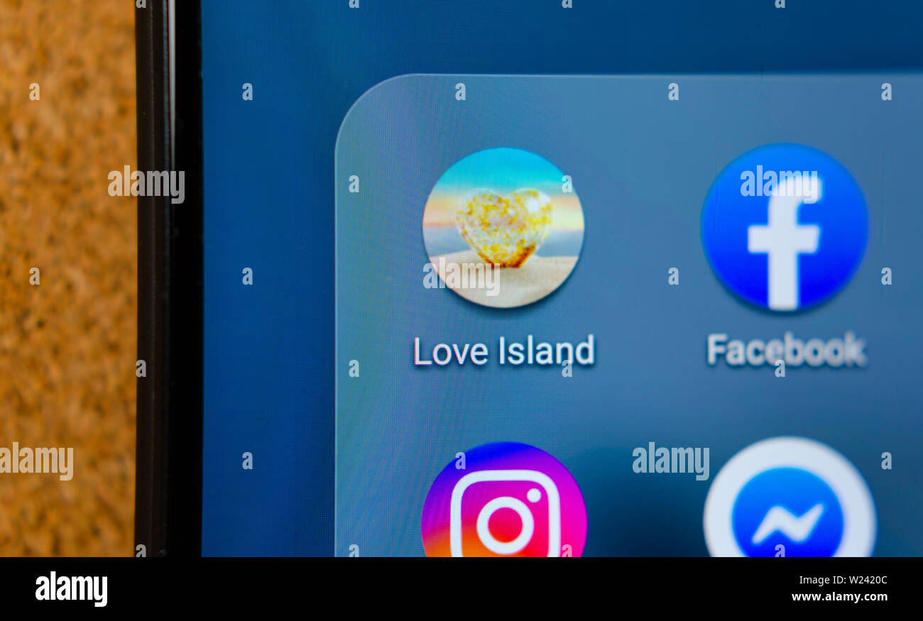 Love Island TV show mobile app icon on the smartphone screen. Stock Photo
