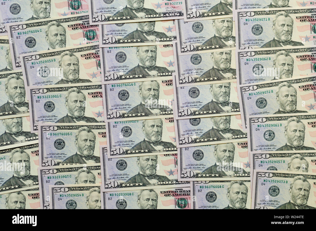 Multiple pattern or background made of 50 dollar bills. Stock Photo