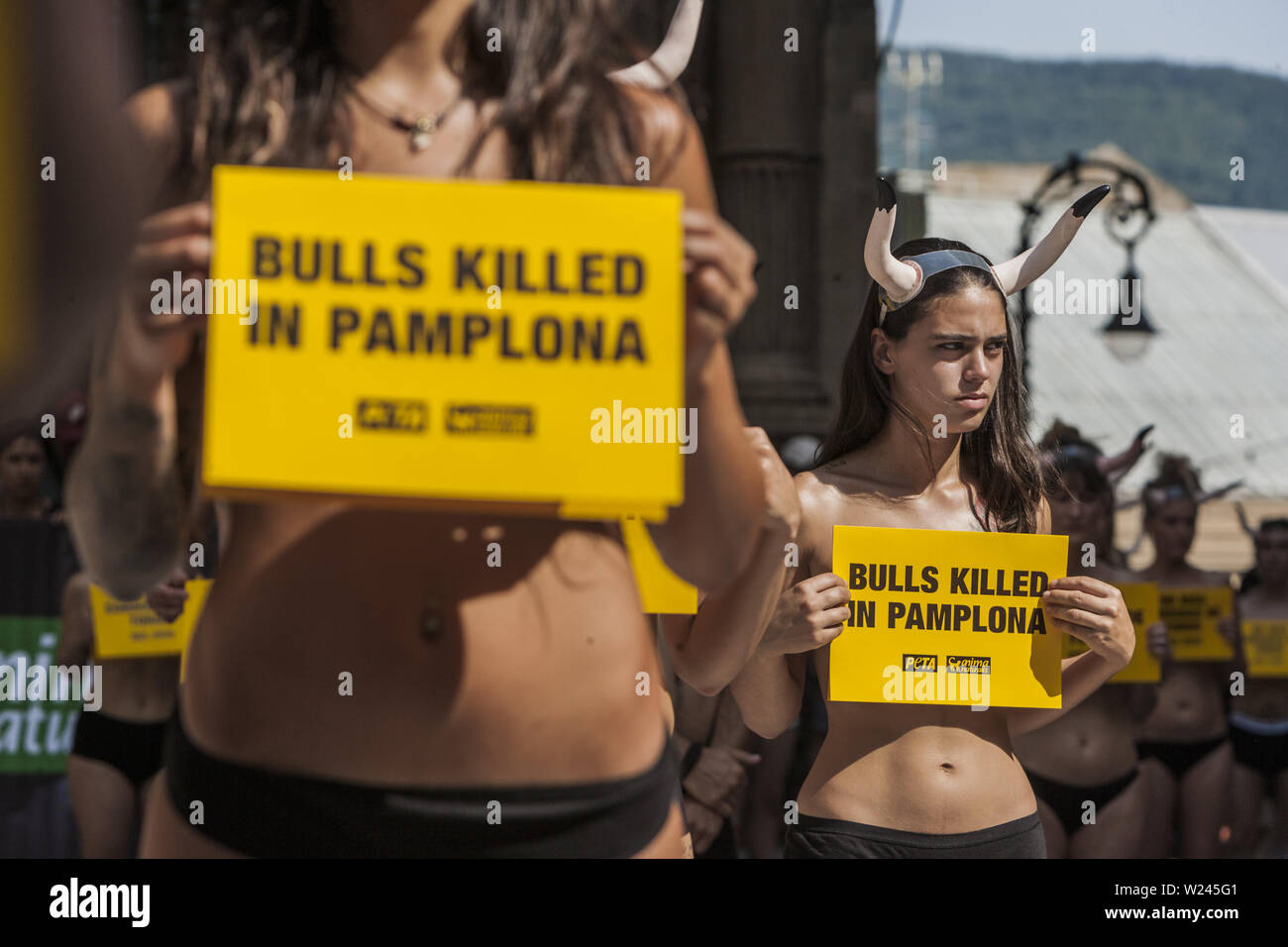 Pamplona, Navarra, Spain. 5th July, 2019. Activists against animal cruelty hold banners anti bullfightings killings in a protesting performance before the San Fermin celebrations in the main square of Pamplona, Spain. Credit: Celestino Arce Lavin/ZUMA Wire/Alamy Live News Stock Photo